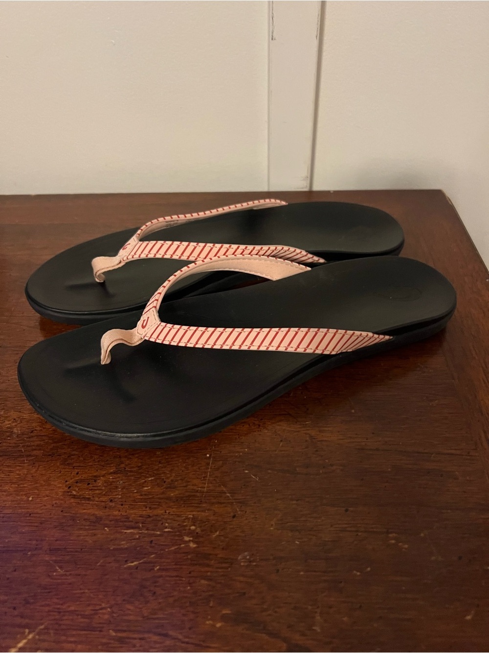 OluKai Black Flip-Flops with Pink Striped Straps size 11